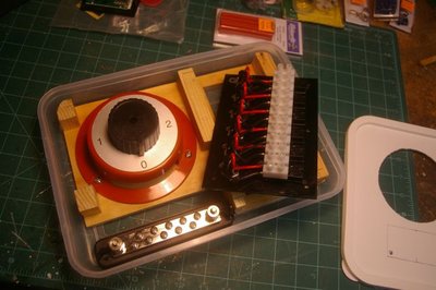 All components assembled, ready for screwing into place and wiring up; note hole in bottom of box for incoming wires